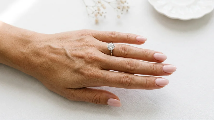 Oval shaped blush pink nails photographed in natural light ideal for wedding photos