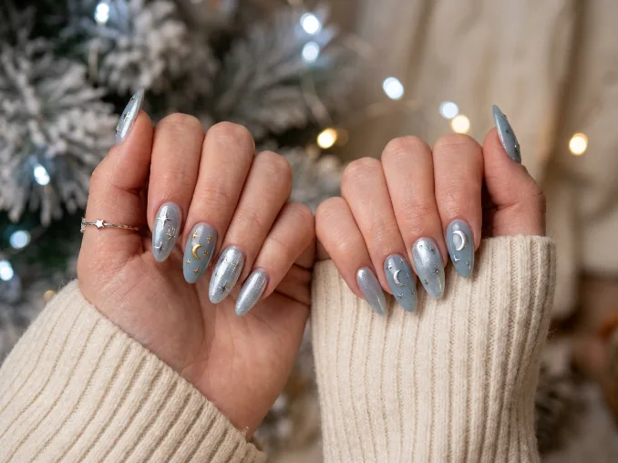 Long blue-gray Christmas nails with moon, stars, and icy chrome shimmer